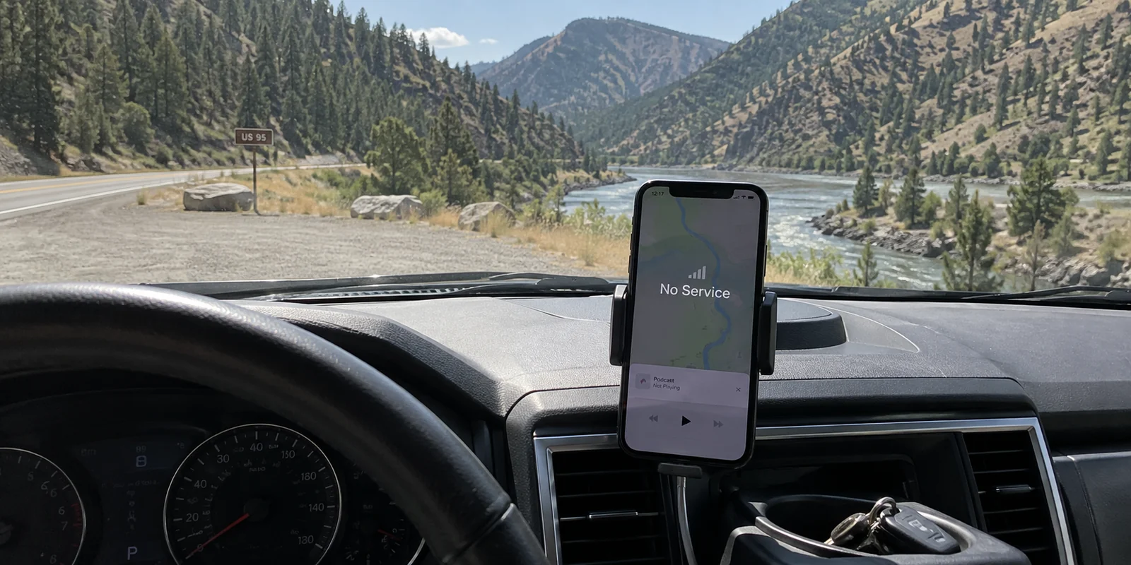 A phone showing no service from a parked car on Idaho's Highway 95